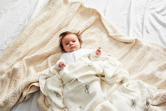 Baby Snuggled in Matchstick Monkey Blanket