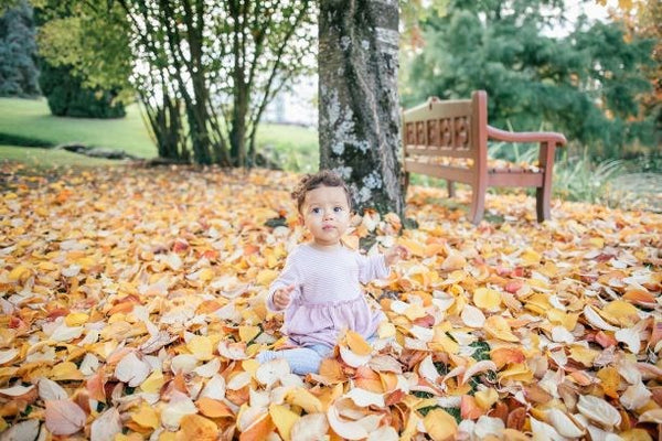 Baby in Autumn Leaves