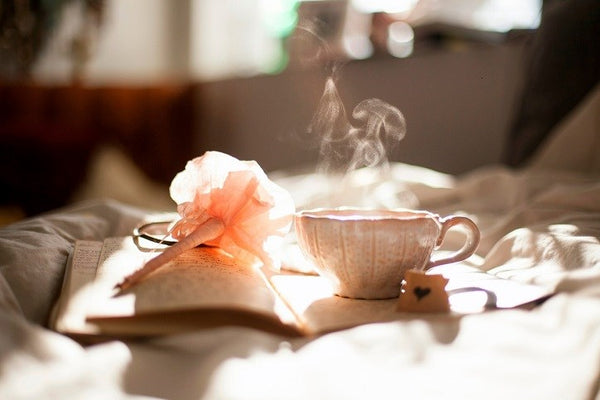 Relaxing cup of tea with book