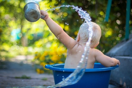 Baby Outdoors Playing in Summer